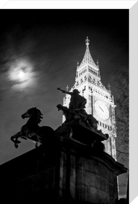 Statue of Boudica with Big Ben floodlit behind.