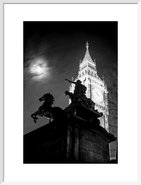 Statue of Boudica with Big Ben floodlit behind.