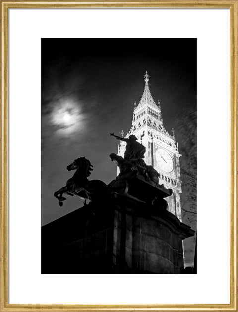 Statue of Boudica with Big Ben floodlit behind.
