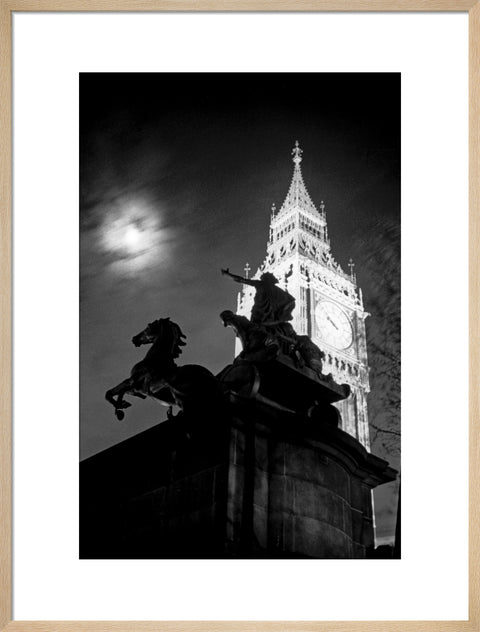 Statue of Boudica with Big Ben floodlit behind.