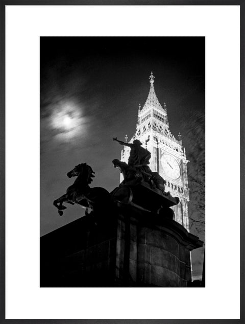 Statue of Boudica with Big Ben floodlit behind.