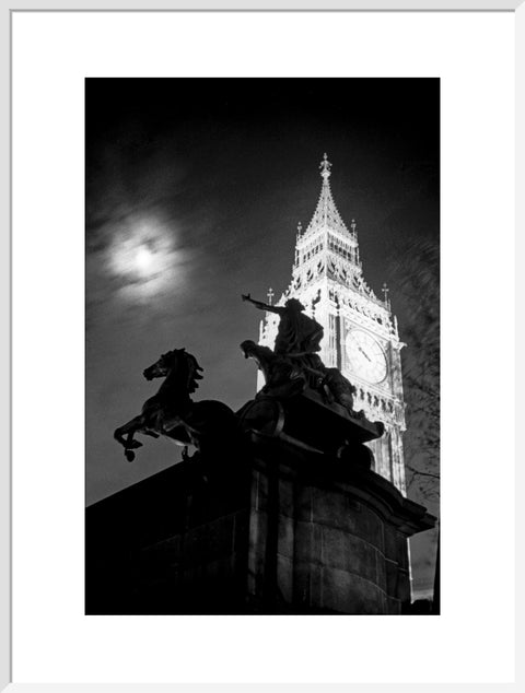 Statue of Boudica with Big Ben floodlit behind.