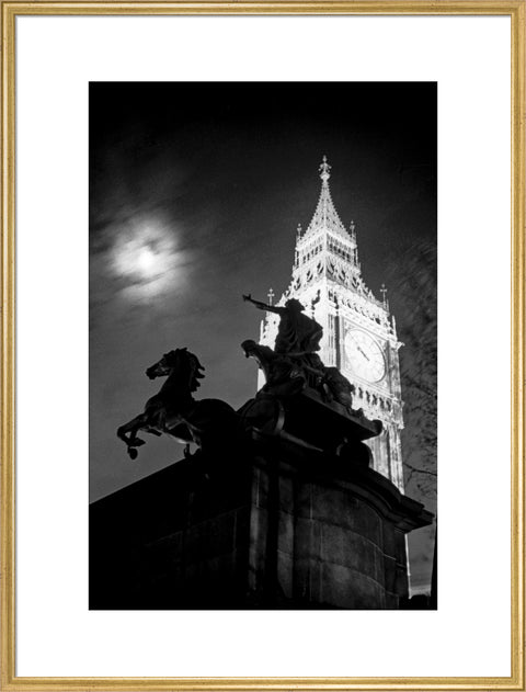 Statue of Boudica with Big Ben floodlit behind.
