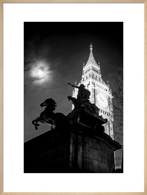 Statue of Boudica with Big Ben floodlit behind.