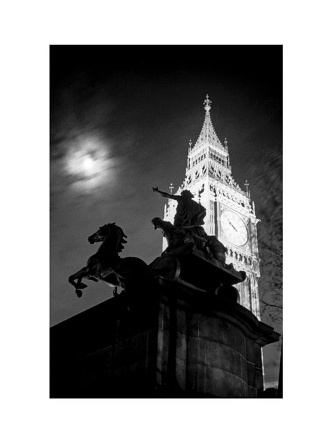 Statue of Boudica with Big Ben floodlit behind.