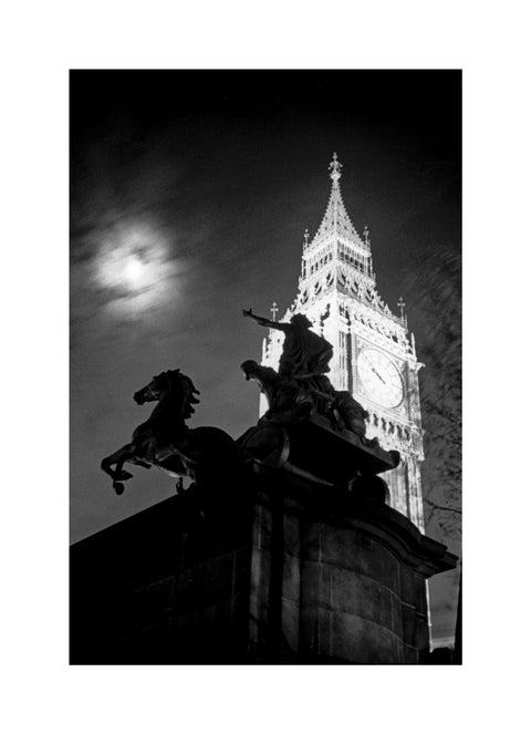 Statue of Boudica with Big Ben floodlit behind.