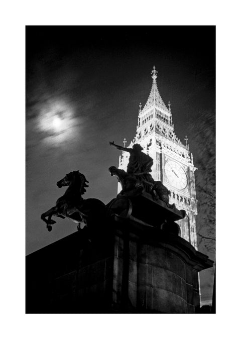 Statue of Boudica with Big Ben floodlit behind.