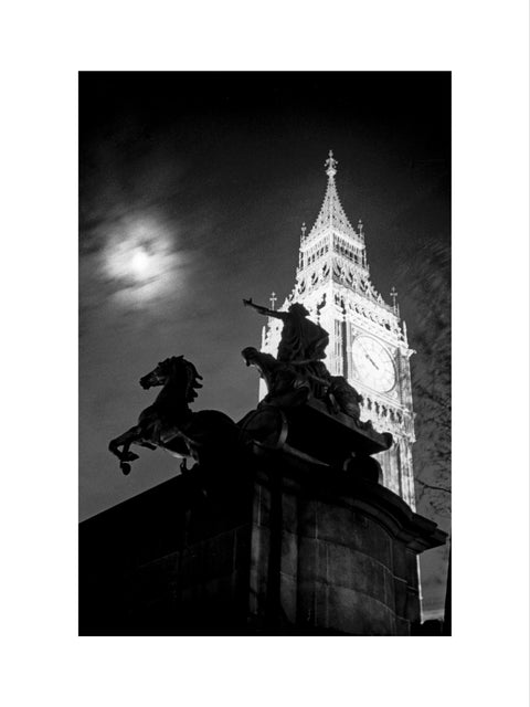 Statue of Boudica with Big Ben floodlit behind.