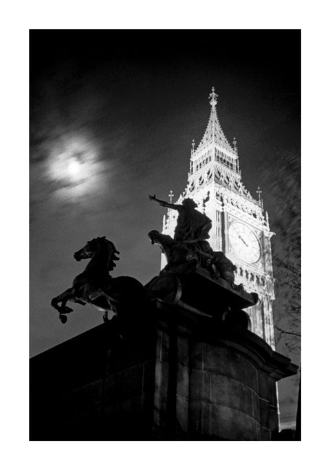 Statue of Boudica with Big Ben floodlit behind.