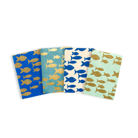 Four notebooks with fish design pattern 