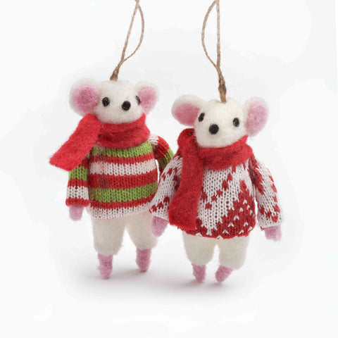 Two knitted mouse ornaments wearing sweaters and scarves on a white background