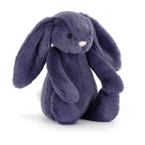 Plush purple bunny toy on a white background