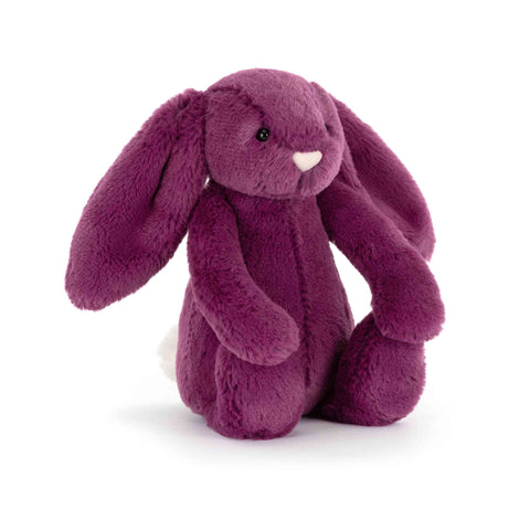 Plush purple bunny toy on a white background