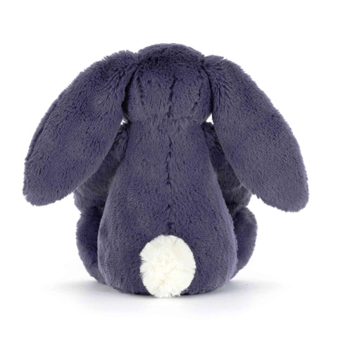 Back view of a plush toy rabbit in dark blue on a white background