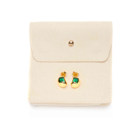 Gold earrings with green e-waste inserts on a beige jewellery pouch against a white background