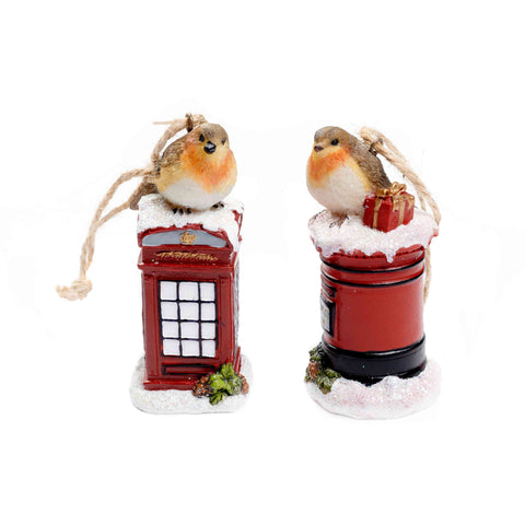 Two Christmas ornaments featuring robins on red telephone boxes and mailboxes with snow.