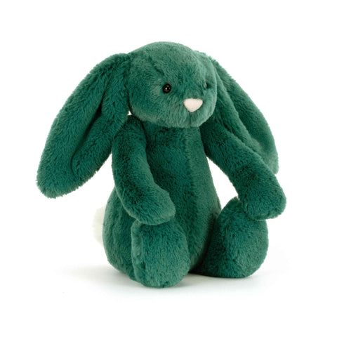 Green plush bunny toy on a white background