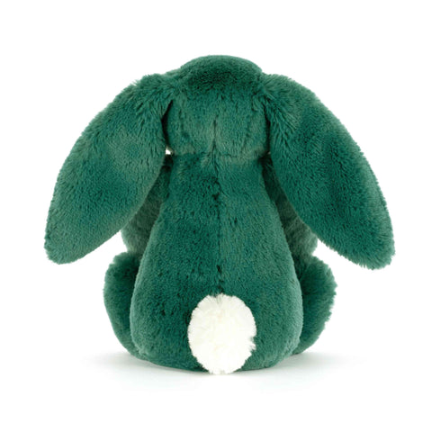 View from the back of a green plush bunny toy on a white background