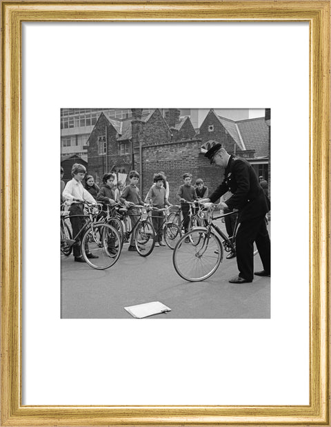A policeman trains school children for their National Cycling Proficiency test at St. Mary's School, Finchley