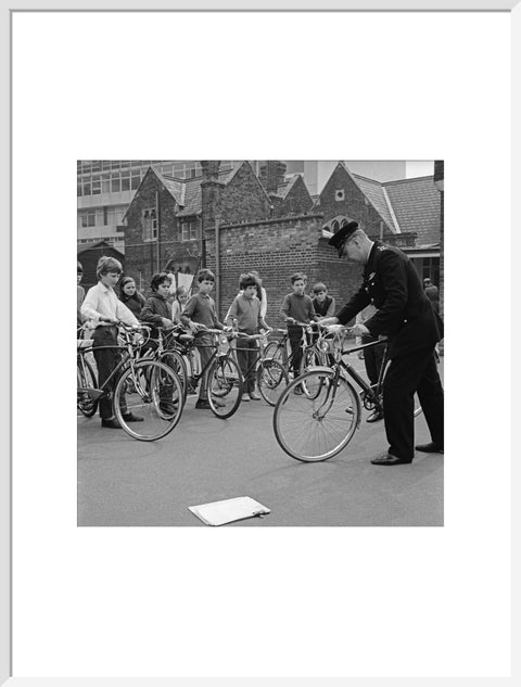 A policeman trains school children for their National Cycling Proficiency test at St. Mary's School, Finchley