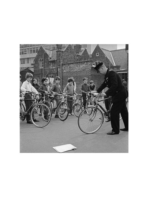A policeman trains school children for their National Cycling Proficiency test at St. Mary's School, Finchley