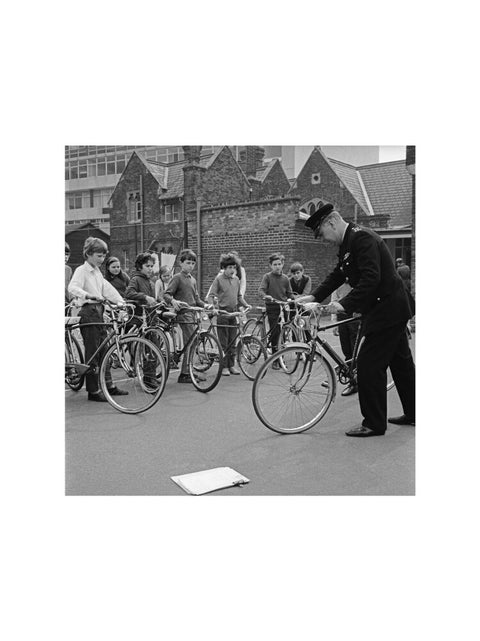 A policeman trains school children for their National Cycling Proficiency test at St. Mary's School, Finchley