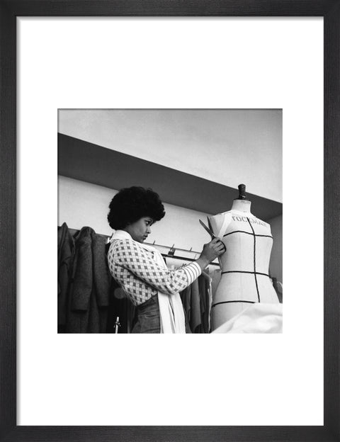 A female student works on a dressmaker's mannequin at Southgate Technical College