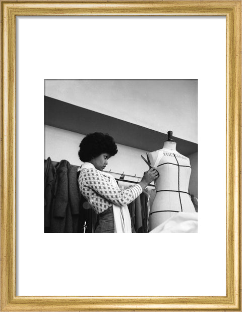 A female student works on a dressmaker's mannequin at Southgate Technical College