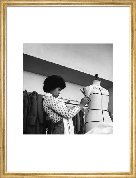 A female student works on a dressmaker's mannequin at Southgate Technical College