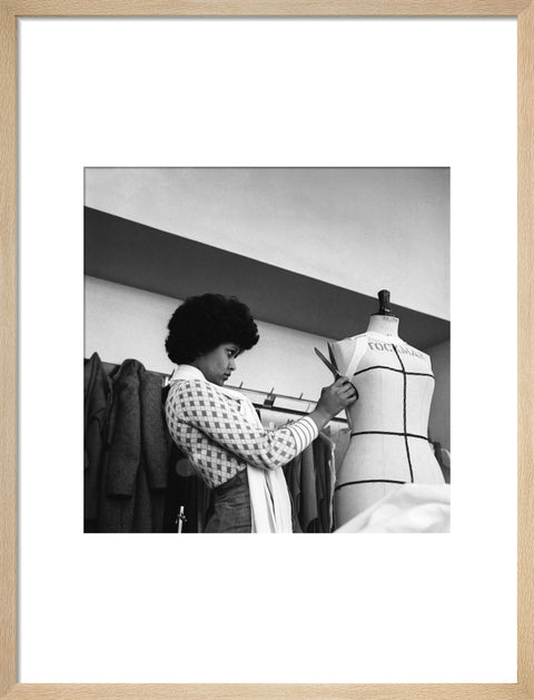 A female student works on a dressmaker's mannequin at Southgate Technical College