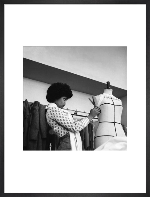 A female student works on a dressmaker's mannequin at Southgate Technical College