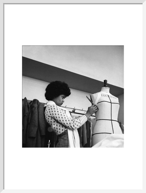 A female student works on a dressmaker's mannequin at Southgate Technical College