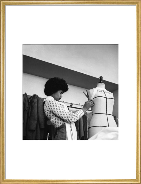A female student works on a dressmaker's mannequin at Southgate Technical College