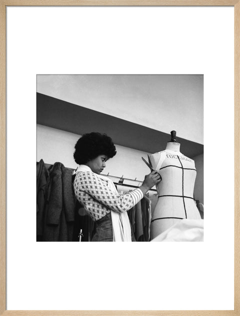 A female student works on a dressmaker's mannequin at Southgate Technical College