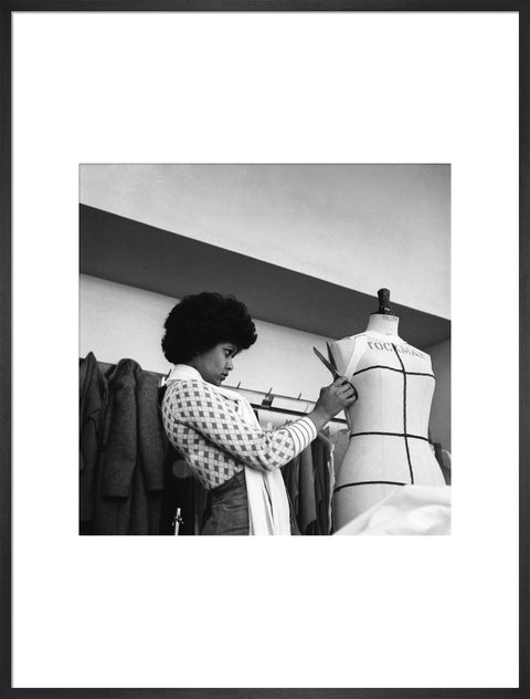 A female student works on a dressmaker's mannequin at Southgate Technical College