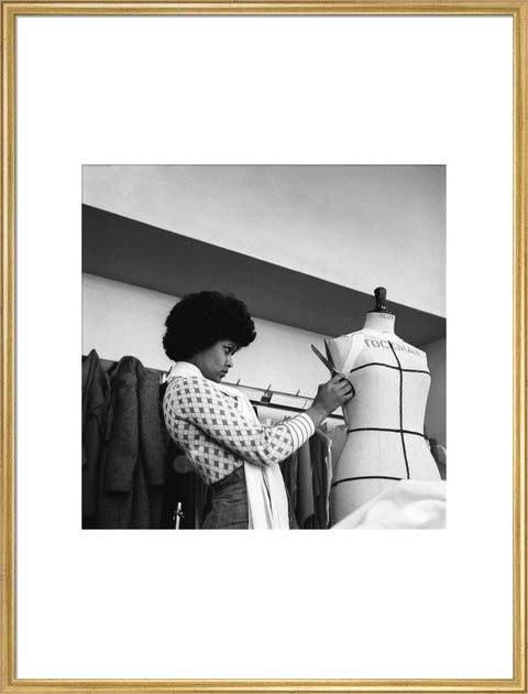 A female student works on a dressmaker's mannequin at Southgate Technical College