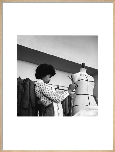 A female student works on a dressmaker's mannequin at Southgate Technical College