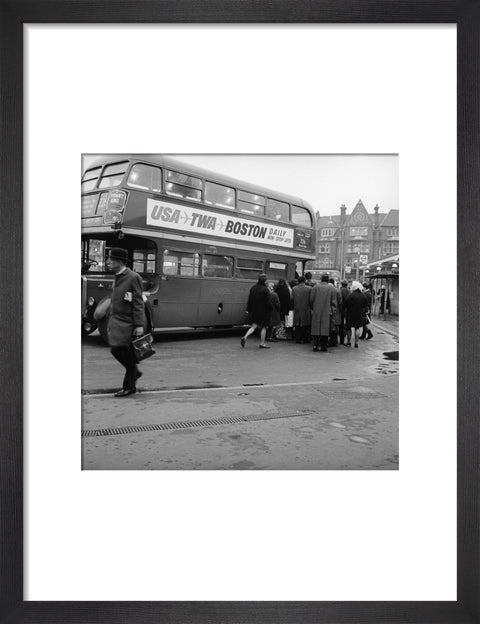 Commuters boarding a bus in Golders Green