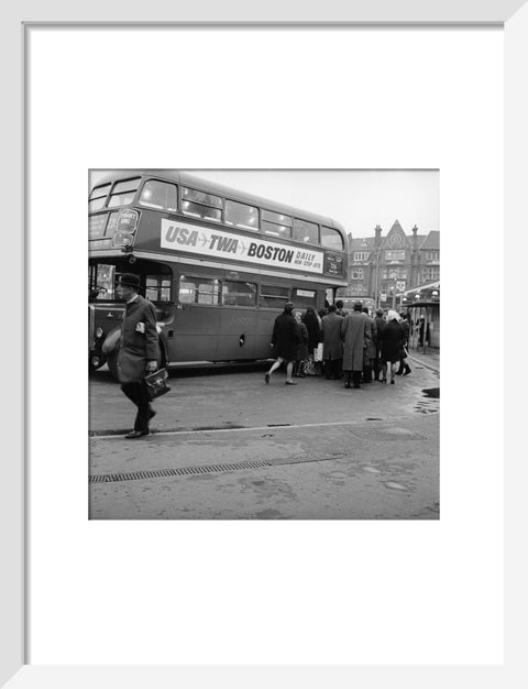 Commuters boarding a bus in Golders Green
