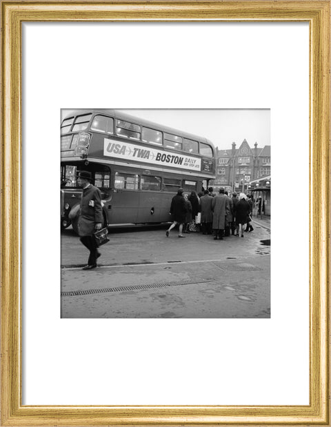 Commuters boarding a bus in Golders Green