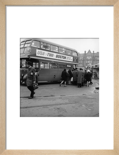 Commuters boarding a bus in Golders Green