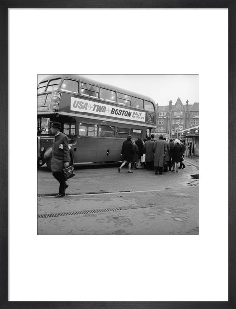 Commuters boarding a bus in Golders Green