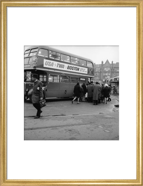 Commuters boarding a bus in Golders Green