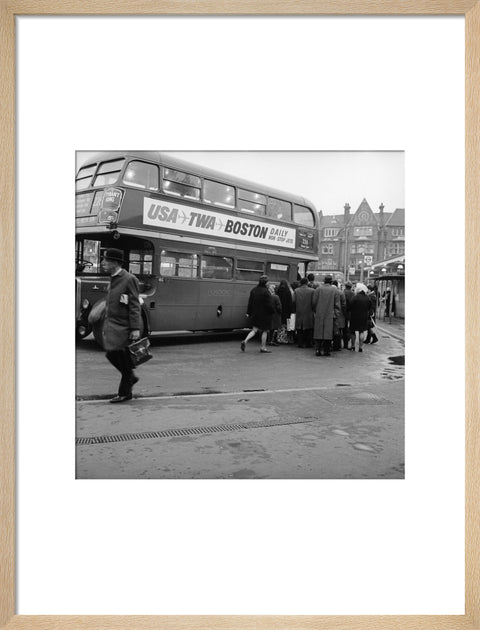 Commuters boarding a bus in Golders Green
