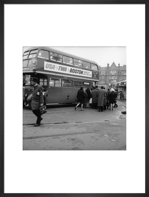 Commuters boarding a bus in Golders Green