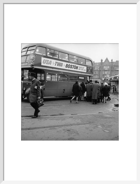 Commuters boarding a bus in Golders Green