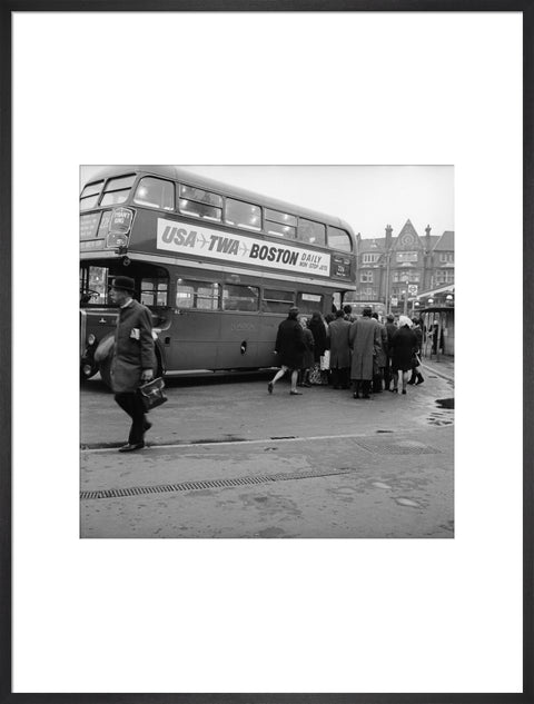 Commuters boarding a bus in Golders Green