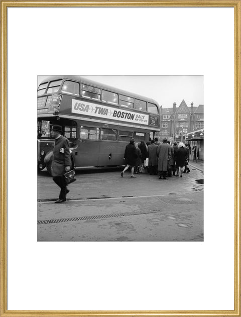 Commuters boarding a bus in Golders Green