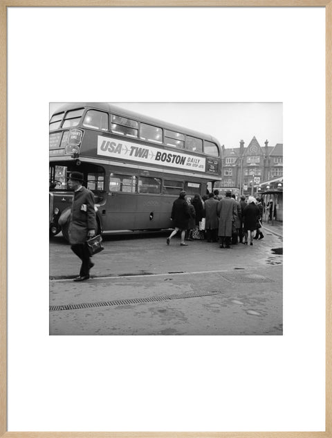 Commuters boarding a bus in Golders Green