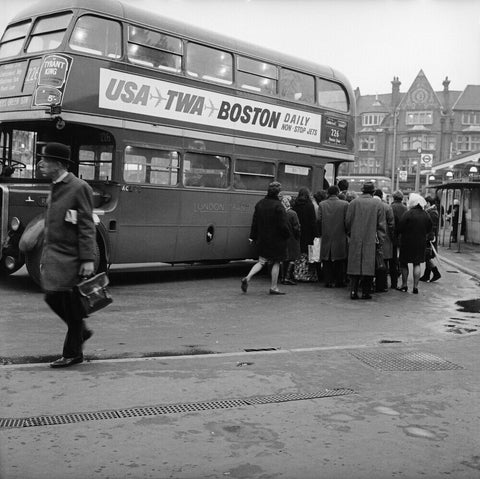 Commuters boarding a bus in Golders Green
